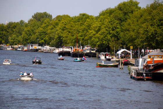 Boats along the Amstel River in Amsterdam